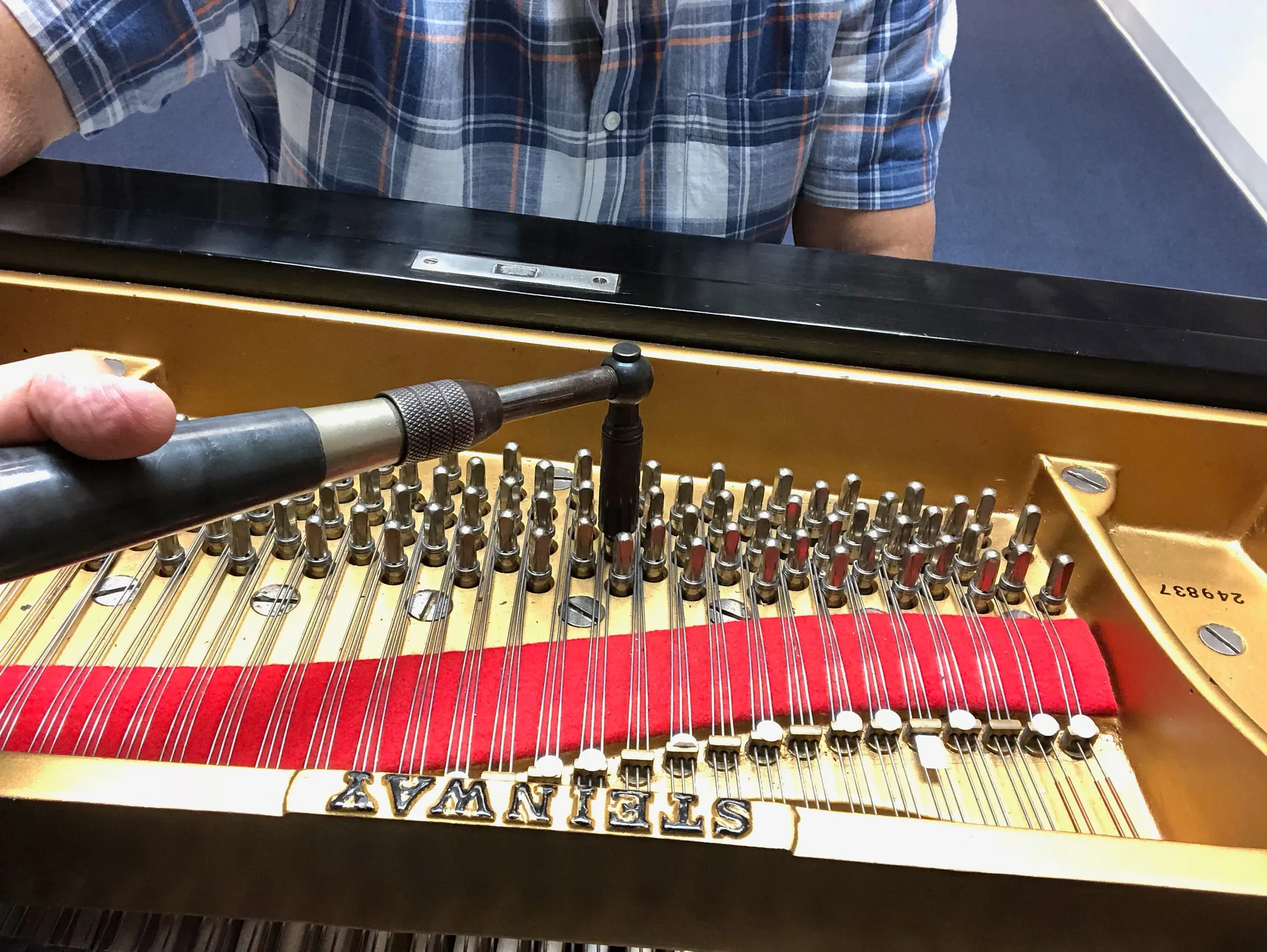 Marty Karmiol tuning a Steinway grand piano